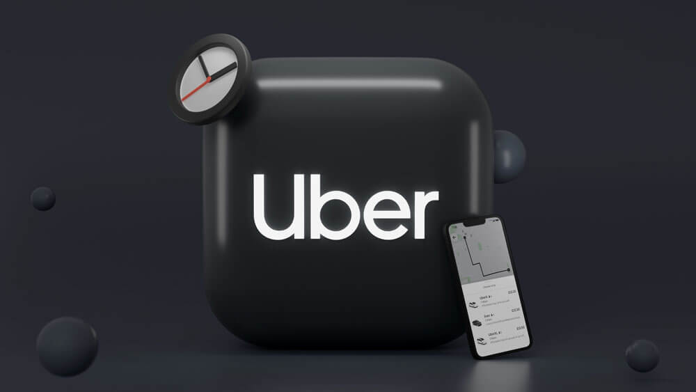 Uberのロゴとスマートフォン